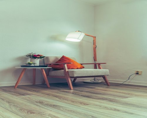 Cozy reading corner with warm artificial lighting