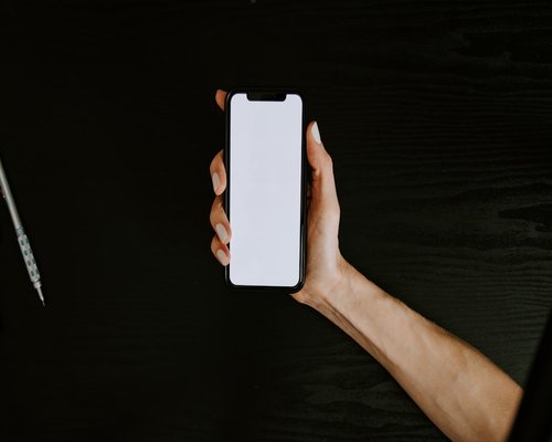 Hands holding a smartphone at a comfortable reading distance